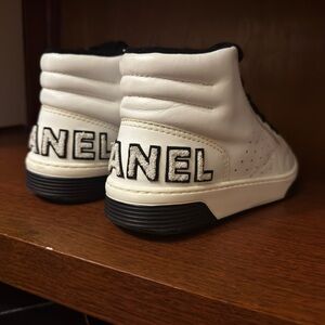 CHANEL Cream and Black High-Top Sneakers